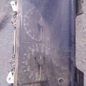 Front view of a used Toyota Cressida dashboard cluster with gauges and indicator lights visible.Front view of