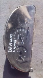 Front view of a used Daewoo Lanos car instrument cluster showing gauges and indicator lights.Front view of a u