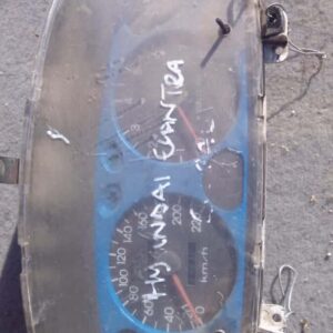 Front view of a used Hyundai Elantra instrument cluster showing speedometer and gauges assembly.Front view of