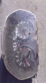 Front view of a used Kia Picanto dashboard instrument cluster showing speedometer and gauges.Front view of a u