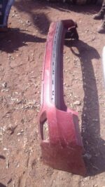 Used rear bumper for Jeep Grand Cherokee, shown from rear angle with minor wear visible.Used rear bumper for J