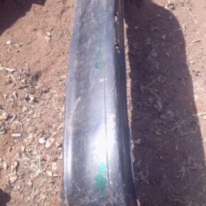 Rear bumper for Toyota Tazz, viewed from rear angle, used condition with mounting points visible.Rear bumper f
