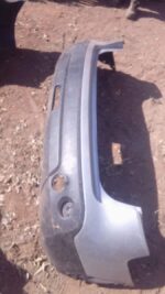 Rear view of used Nissan Qashqai rear bumper showing full width with mounting points visible.Rear view of used