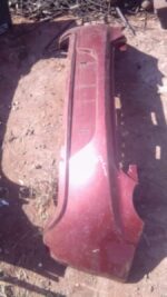 Rear view of used rear bumper for Alfa Romeo Giulietta showing complete bumper assembly and mounting points.Re