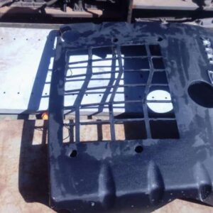Front angle view of a used engine cover for a 2006 Mahindra Scorpio, showing mounting points and surface detai