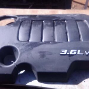 Front view of a used Dodge Journey engine cover showing mounting points and molded details.Front view of a use