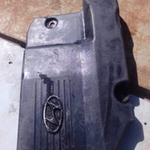 Front-facing view of a used Hyundai Atos engine cover showing surface details and mounting points.Front-facing