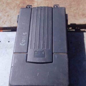 Used black plastic battery cover for VW Golf 5 shown from top angle with connectors visibleUsed black plastic