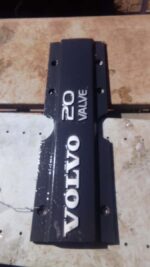 Top view of a used Volvo S70 engine cover showing mounting points and surface details.Top view of a used Volvo