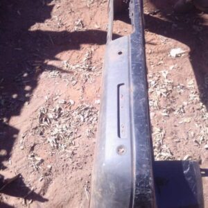 Rear bumper for Land Rover Discovery shown from rear angle, used condition with minor wear visible.Rear bumper