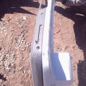 Rear view of a used Land Rover Discovery rear bumper showing mounting points and taillight cutouts.Rear view o