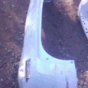 Rear view of a used rear bumper for a Toyota Avanza, showing the full bumper with mounting points visible.Rear
