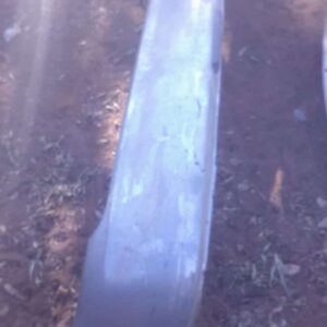 Rear bumper for 2005 Toyota Tazz shown from front angle, used condition with visible mounting points.Rear bump
