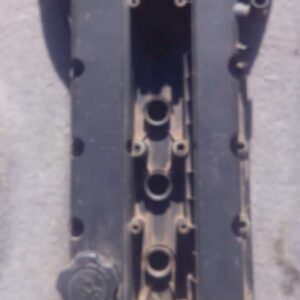 Used tappet cover for 1.6 engine, shown angled front view with visible mounting holes.Used tappet cover for 1.