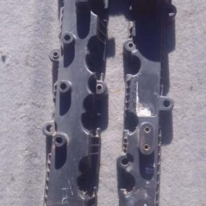 Front angle of a used 2.2 Tappet Cover for a 2010 TataTelcoline displayed on a wooden surface.Front angle of a