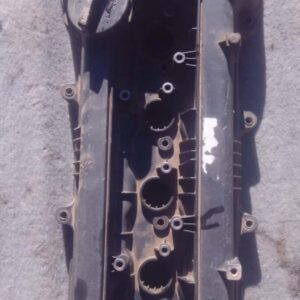 Top view of a used tappet cover with visible bolt holes and gasket surface for Hyundai I20.Top view of a used