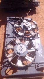 Used radiator cooling fan assembly viewed from front, showing fan blades and mounting points.Used radiator coo