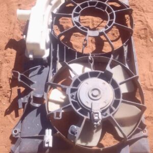 Front view of a used radiator fan assembly for a 2008 Toyota Prius, showing blades and motor housing.Front vie