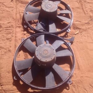 Front view of a used radiator fan assembly for a 1994 Mercedes W124, showing blades and housing side.Front vie