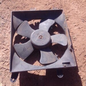 Front view of a used radiator fan assembly for a 2006 Chevrolet Optra, showing the fan blades and housing.Fron