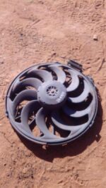 Used BMW E36 radiator fan viewed from front, showing blades and surrounding shroud in detail.Used BMW E36 radi