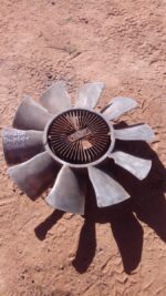 Used viscous radiator fan for Mazda Drifter shown angled from front, displaying blade and hub assembly.Used vi