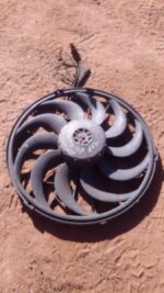 Used BMW E36 radiator fan assembly viewed front-on, showing blades and mounting frame clearly.Used BMW E36 rad