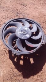 Front view of a used BMW E36 radiator cooling fan assembly showing blades and housing.Front view of a used BMW