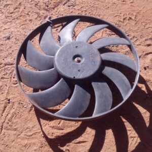 Front view of a used Ford KA radiator fan showing blades and motor assembly.Front view of a used Ford KA radia