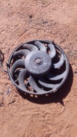 Front view of a used radiator fan for Opel Astra 1.6, showing blades and mounting points clearly.Front view of