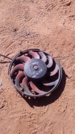 Used radiator fan assembly for Opel Kadet, front view showing fan blades and motor housing.Used radiator fan a
