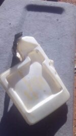 Front view of used BMW E60 5 Series 520D washer bottle showing body and mounting points.Front view of used BMW