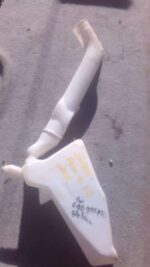 Front angle view of a used washer bottle for a Volkswagen Polo, showing mounting points and filler neck.Front
