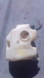 Used washer bottle for Opel Astra, shown front-facing with visible mounting points and fluid inlet.Used washer