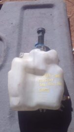 Used washer bottle for 2004 Peugeot 406, shown from a front angle with cap and hose visible.Used washer bottle
