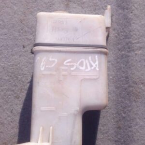 Side view of a used Hyundai Atos windshield washer fluid reservoir bottle with attached hose and sensor.Side v