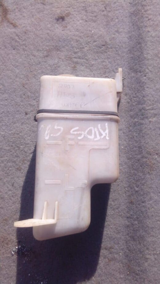 2007 Hyundai Atos Water Bottle - Used Side view of a used Hyundai Atos windshield washer fluid reservoir bottle with attached hose and sensor.Side v