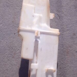 Front view of a used Nissan Micra water bottle container with cap, showing some wear and dirt marks.Front view
