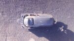 Right inner door handle for Nissan Tiida, shown from front angle, used condition.Right inner door handle for N