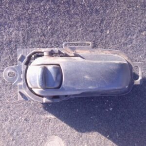 Right inner door handle for Nissan Tiida, shown from front angle, used condition.Right inner door handle for N