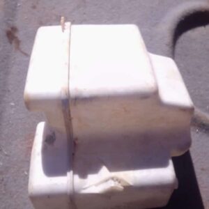 Used washer fluid bottle for Land Rover, shown front angle on plain background.Used washer fluid bottle for La