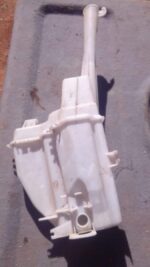 Front angled view of a used washer bottle for a Kia Sportage, showing fluid reservoir and cap.Front angled vie
