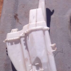 Front angled view of a used washer bottle for a Kia Sportage, showing fluid reservoir and cap.Front angled vie