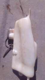 Front angle view of used Renault Clio 1 washer bottle in good condition against white background.Front angle v