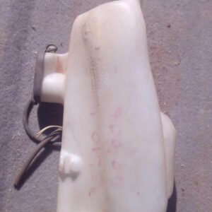 Front angle view of used Renault Clio 1 washer bottle in good condition against white background.Front angle v