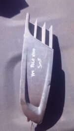 Left headlight cover for Volkswagen Polo, used, shown from front angle on white background.Left headlight cove