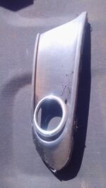 Right spotlight cover for 2014 Volkswagen Polo, used, shown from front angle on a white background.Right spotl