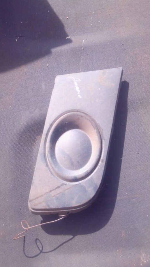 2013 Volkswagen Amarok Right Spotlight Cover - Used Right spotlight cover for Volkswagen Amarok, angled side view, used condition visible surface.Right spotlight