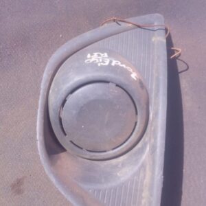 Right side spotlight cover for Ford Figo, angled front view, used condition showing some wear.Right side spotl