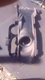 Left spotlight cover for a Ford Mustang GT shown from front angle, used condition visible.Left spotlight cover